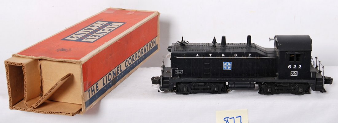 Lionel 622 A.T.S.F. NW-2 w/large GM in OB: Postwar Lionel O gauge 622 A.T.S.F. switcher, C7-8 with light shelf dust. More unusual version with large GM on cab. OB missing flaps and repro insert.