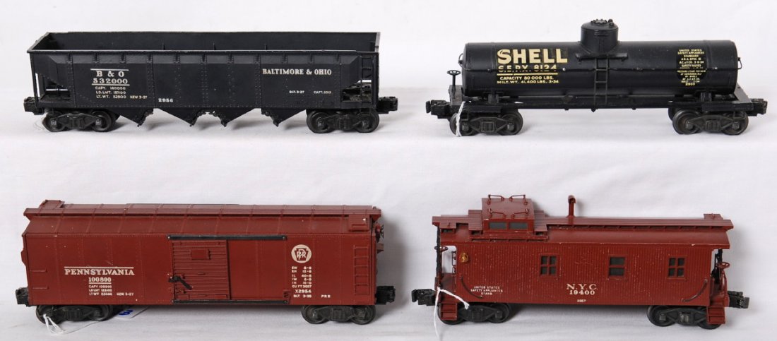 Lionel 2954, 2955, 2956, and 2957 semi-scale freig: Prewar and postwar Lionel O gauge 2954 Pennsylvania boxcar, 2955 Shell tank, 2956 B&O hopper, and 2957 NYC caboose. Semi-scale cars have postwar trucks, C6-7.