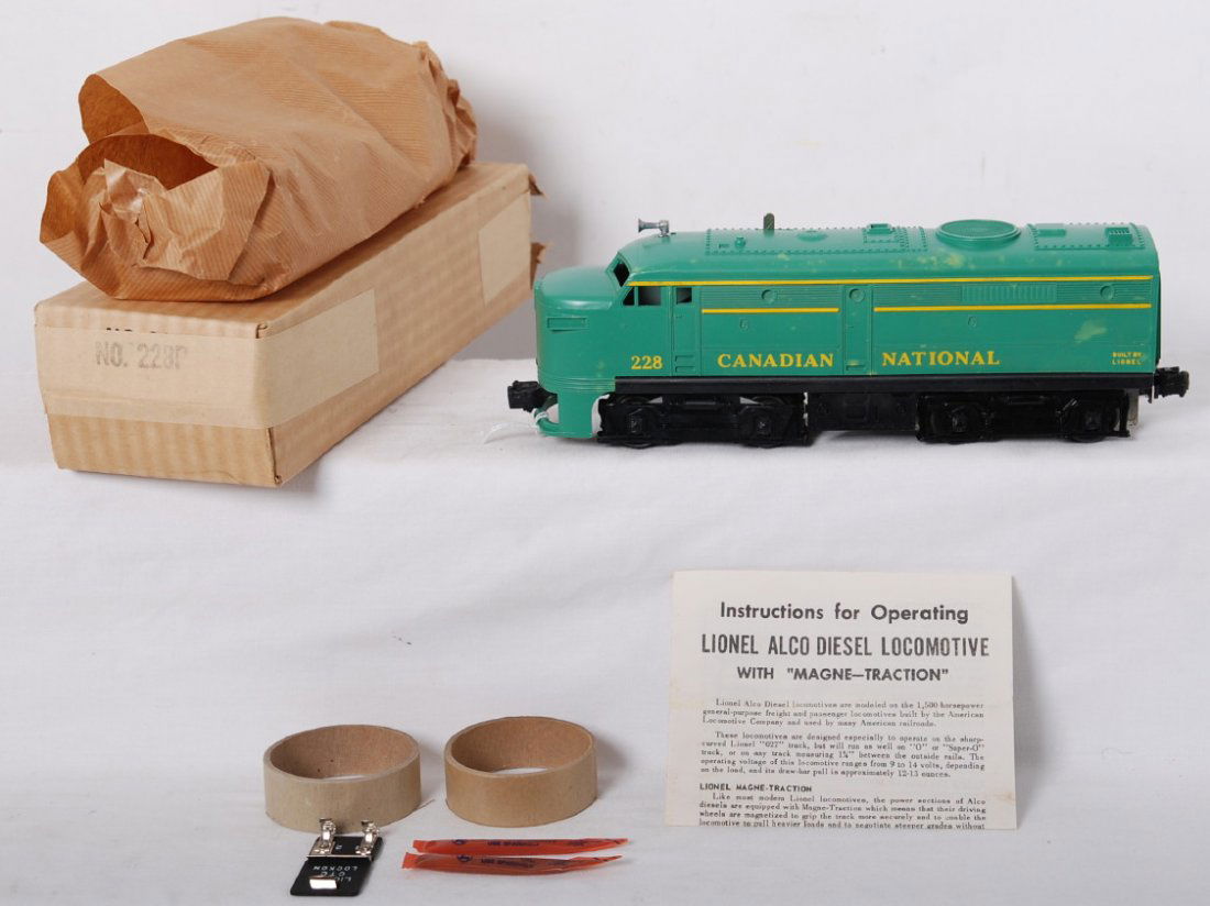 Lionel 228 Canadian Pacific Alco in OB: Postwar Lionel O gauge 228 Canadian Pacific Alco diesel locomotive, unrun however has some light discoloration spots on green. C10 OB includes molded original wrap, instructions, two coupler protectio