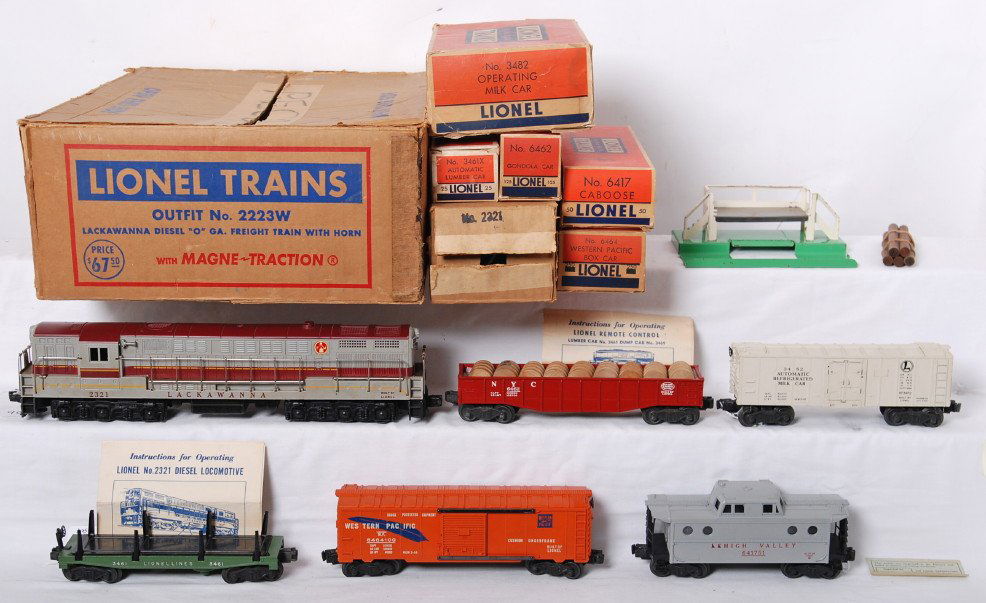 Lionel 2223W Lackawanna diesel O ga. freight in OB: Postwar Lionel O gauge 2223W Lackawanna diesel O ga. freight train with horn with Magne-Traction in original boxes. Trains look C7-8 area. Loco has typical hairlines at screws. Set is composed of 2321