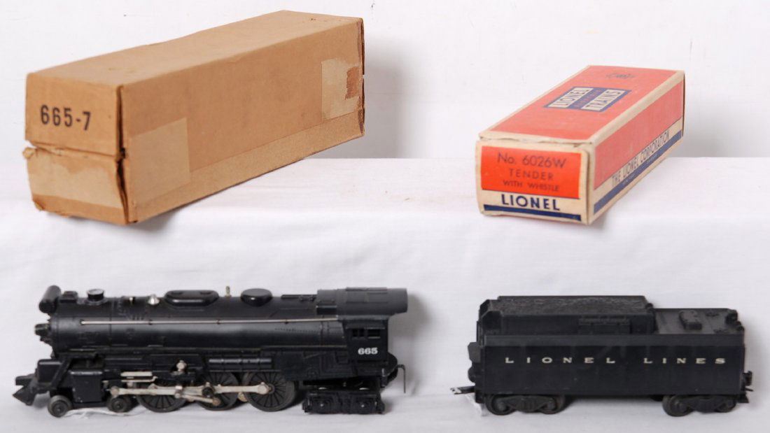Lionel 665 steam loco and 6026W tender in OB: Postwar Lionel O gauge 665 steam locomotive and 6026W tender with whistle, C6-7. Tender box is missing an inner coupler protection flap, loco box opened at both ends. Boxes are very square and solid.