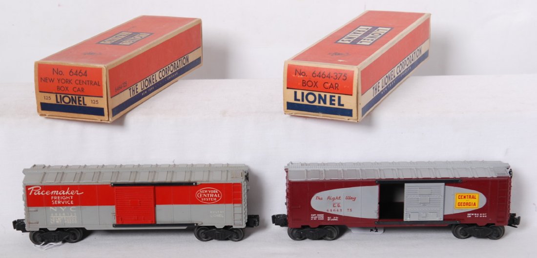 Lionel 6464-125 and 6464-375 boxcars in OB: Postwar Lionel O gauge 6464-125 New York Central boxcar, should clean C8. 6464-375 Central of Georgia boxcar, C8. -375 OB has a spot of moisture damage that has been touched up, otherwise boxes look C