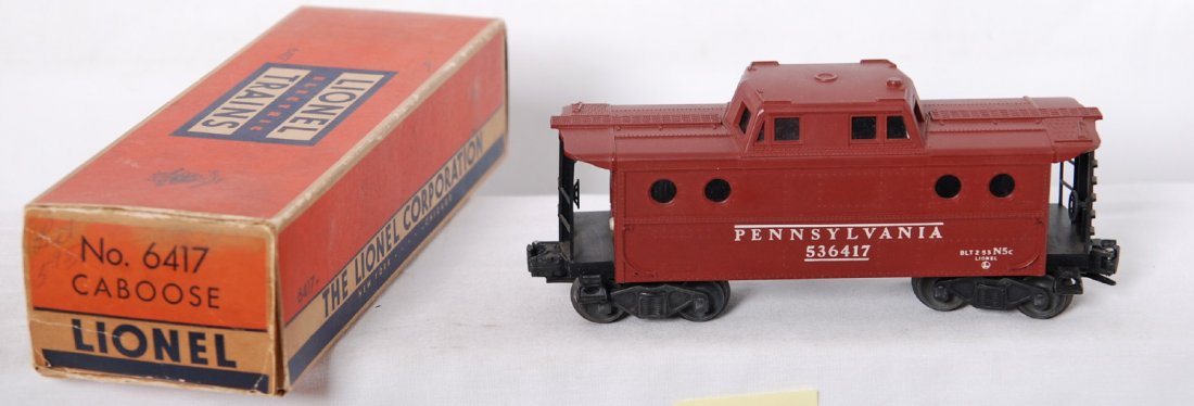 Lionel 6417 Pennsylvania caboose in OB no NYZ: Postwar Lionel O gauge 6417 Pennsylvania caboose, no New York Work Zone, in original box, C8-9. Box has replaced tuck flap, inner tape repairs, etc. Boxes are square and solid.