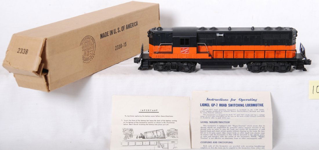 Lionel 2338 GP-7 diesel locomotive in OB w/wrap..: Postwar Lionel O gauge 2338 Milwaukee Road GP-7 diesel road switcher locomotive with uninterrupted stripe. Minor paint blemishes around a cab corner, C8. Box looks C9. Two instructions sheets included