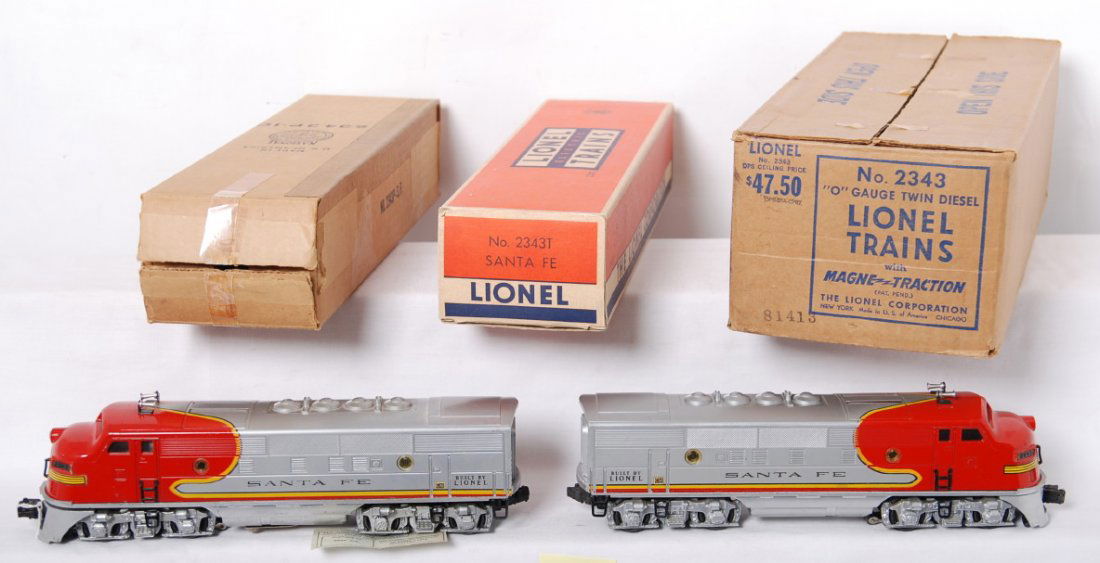 Lionel 2343 Santa Fe twin diesel locos in M.C.: Postwar Lionel O gauge 2343 Santa Fe EMD F3a twin diesel locomotives in master carton and inner boxes. Powered unit has a little touchup to yellow of nose decal. Trains look C7 area. Original porthole