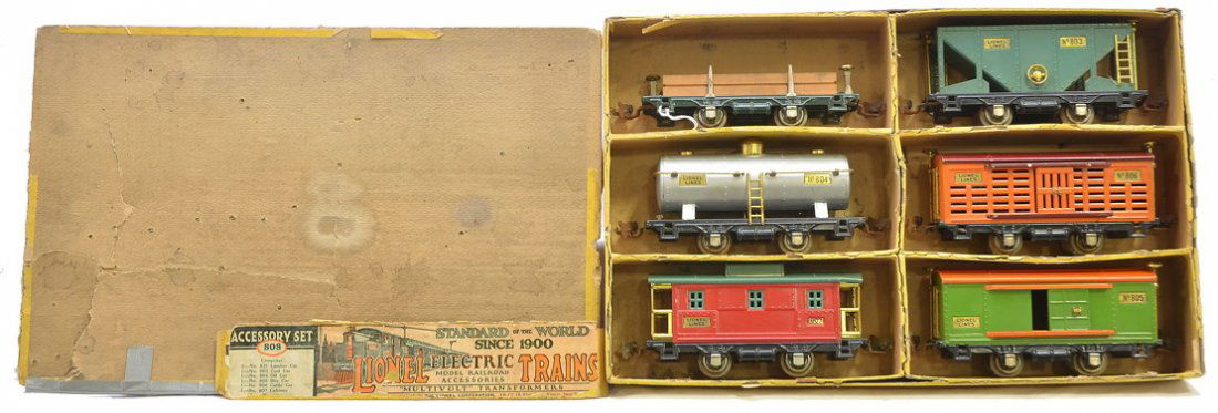 Lionel 808 Accessory Set 800 Series Freight Cars: Lionel prewar O gauge 808 accessory set containing; 831 dark green lumber car, 803 peacock coal car, 804 aluminum oil car, 805 pea green boxcar with orange roof and door guides, 806 orange cattle car