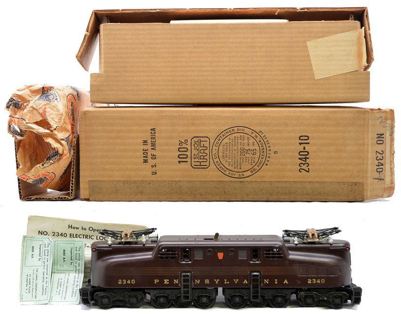 Lionel 2340 Tuscan Pennsylvania GG1 Diesel MIB: Lionel postwar 2340 Tuscan Pennsylvania GG1 diesel with instruction sheet and inspection tags in OB that has two original cardboard inserts and paper wrap. The GG1 has never been run and the stampings