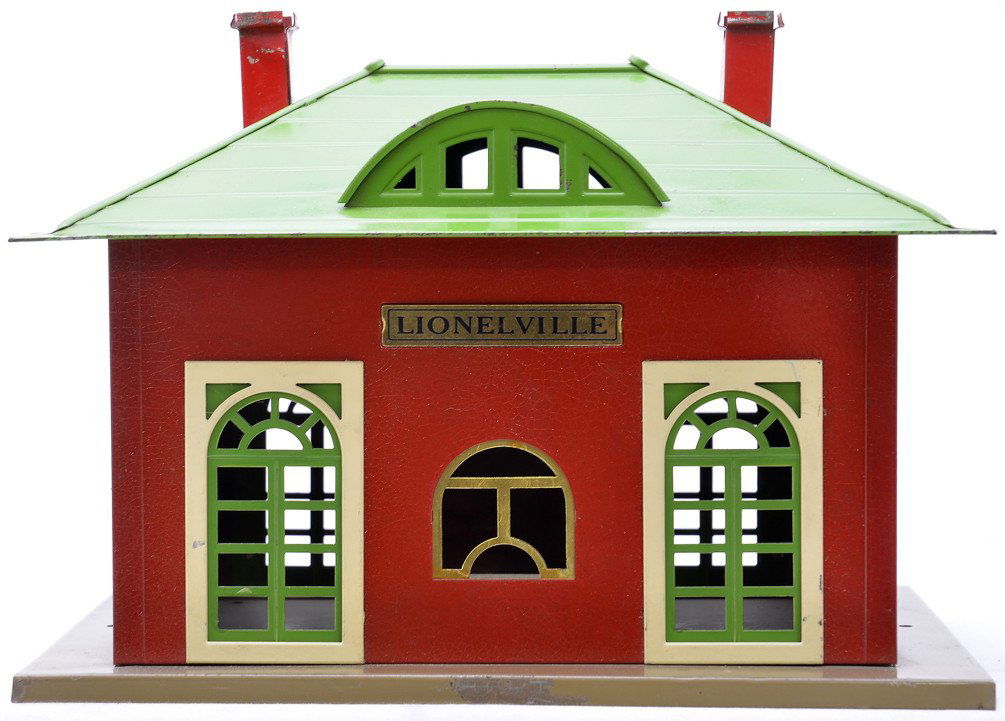 Lionel Prewar 126 Lionelville Station LIKE NEW: Lionel prewar 126 Lionelville station with Mojave base, crackle red walls, pea green roof and door, ivory door frames and window inserts, brass plates and red chimneys. The roof on the station is C6.