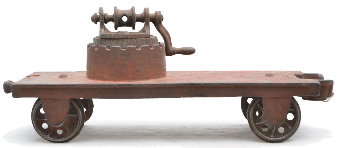 Arcade Cast Iron Pile Driver Floor Toy: Arcade cast iron pile driver floor toy with flanged wheels. The car is missing the upright pile driver and is C4. This toy is from the Rick Ralston collection.