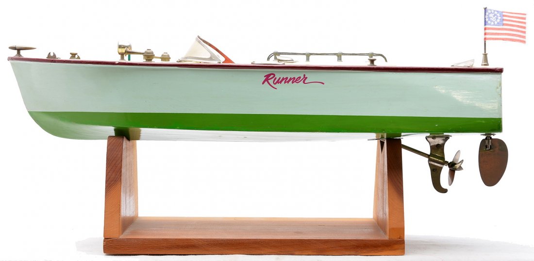 Ito Japanese Wooden Battery Operated Boat: Ito Japanese wooden battery operated boat, circa 1950s. The boat is lettered Runner on each side and is complete with all trim. Also included is a wooden stand. The boat is C7.