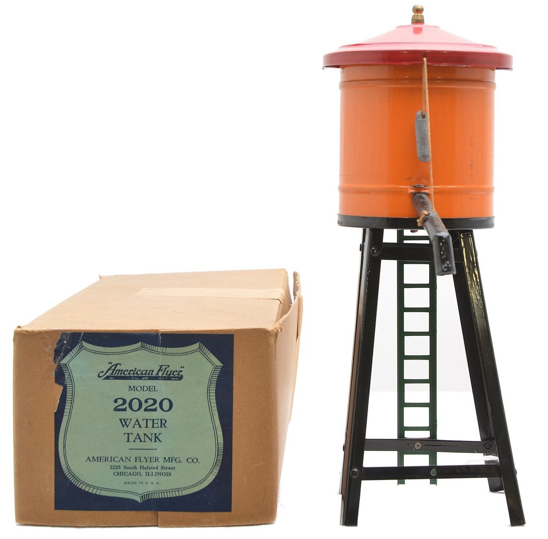 Am Flyer Prewar 2020 Water Tank LN Boxed: American Flyer prewar O gauge 2020 water tank with black tower and spout, orange tank that has a red roof and green ladder in OB, C8. The orange tank has no lettering. The OB is complete with all flap