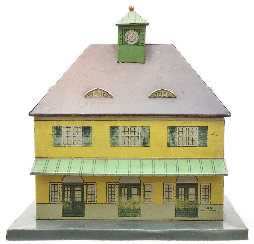 Karl Bub KBN German Litho Train w/Clock Tower: Karl Bub (KBN) German lithographed train station with clock tower, C5. The station measures 9 inches in length, six inches in width and is 9 inches high.