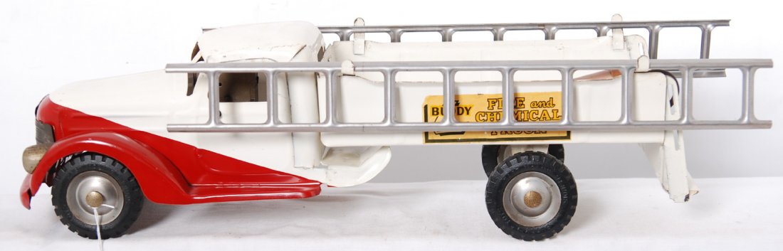 Buddy L Fire and Chemical Truck w/siren: Buddy L Fire and Chemical Truck with siren, water pump, and two ladders. Truck has some light surface rust, O/W C6-7. Truck measures approximately 22 inches long