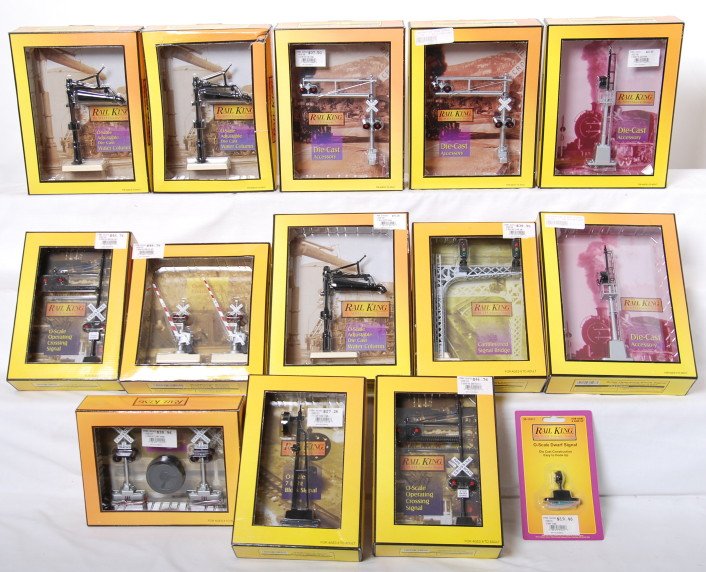 14 Railking scale signals and crossings: MTH Railking modern O gauge scale signals and crossings in OBs. Fourteen items include 11011 dwarf, two 11005 block signals, 11013 block signal, 11009 signal bridge, 11006 crossing, 11014 flashers wit