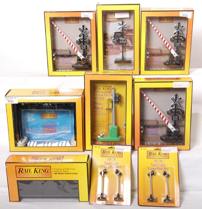 9 Railking postwar style signals and lights: MTH Railking modern O gauge postwar style signals and lights in OBs. Includes 120001 Pennsylvania girder bridge, 9026 signal bridge, 1034 block signal, two 1073 crossing gates, 1093 banjo signal, and 