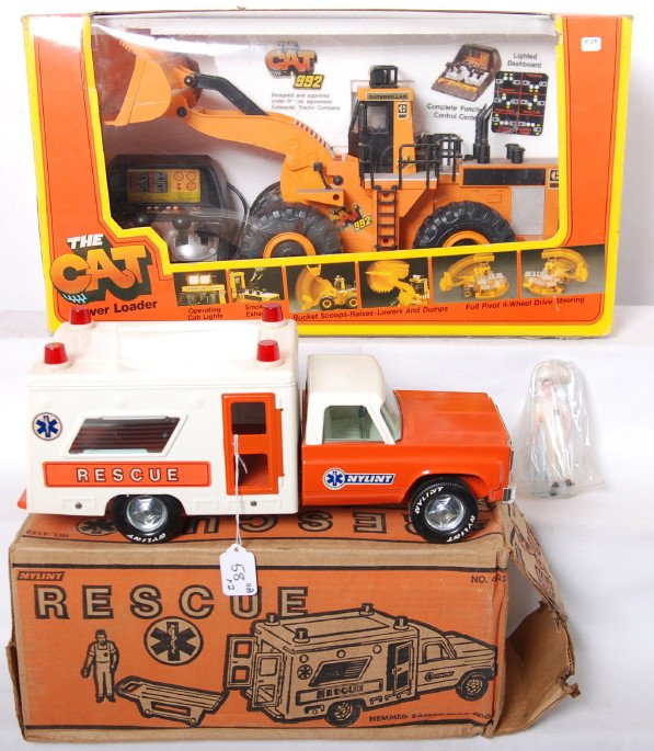 Nylint No. 4132 Rescue and New Bright No. 2190 T: Nylint No. 4132 Rescue, pressed steel toy truck in original box with an insert, EMT figure sealed in original bag, and gurney. Should clean C8-9. Box is square and solid with no missing flaps. Nylint 