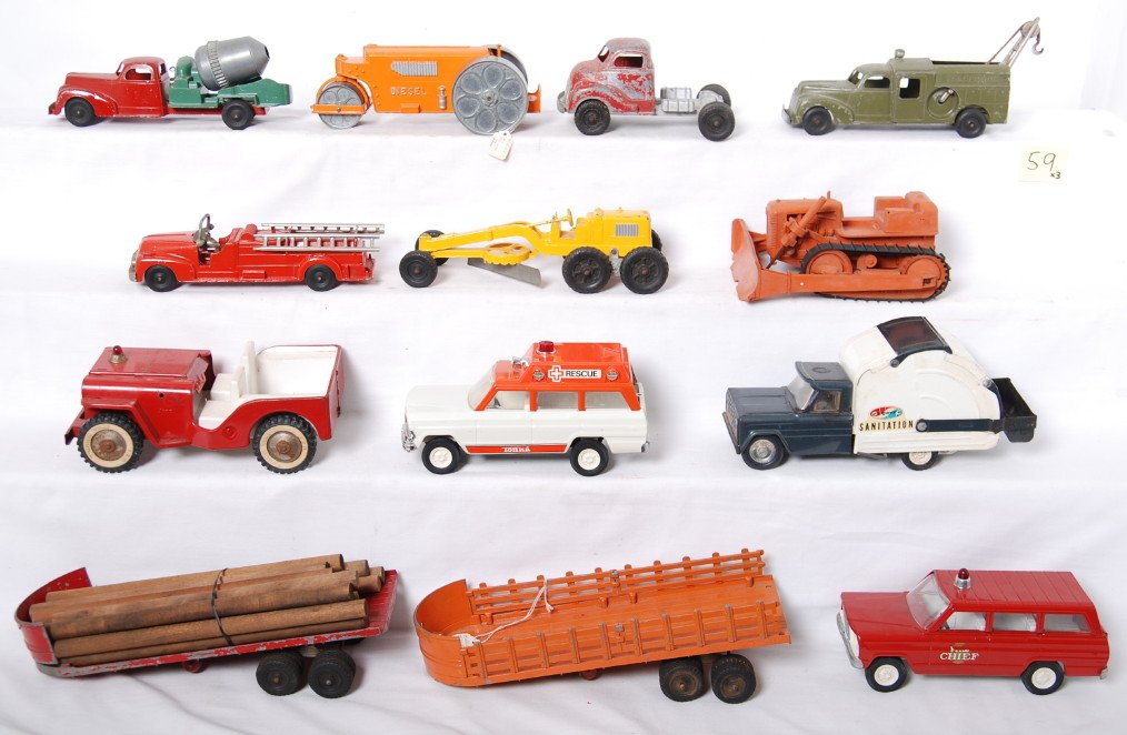 Tonka, Structo, Hubley diecast and pressed steel: Three Tonka pressed steel trucks, one Structo pressed steel Sanitation, six Hubley Kiddetoy vehicles and a trailer without tractor truck. Vehicles range C5 to C8 area. Also included is a plastic bulld