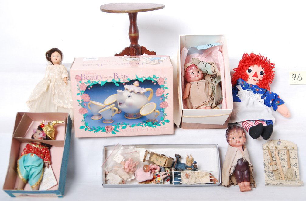 Vintage dolls, table, mini dolls, Madame Alexand: Madame Alexander 567 Thailand blinker doll in OB, numerous mini dolls, cast iron doll toys, 1987 Raggedy Ann, two celluloid dolls, one unmarked plastic blinker, DisneyÍs Beauty and the Beast toy chin