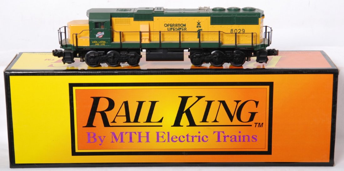 Railking C&NW SD60 with Proto: MTH Railking modern O gauge Chicago and Northwestern RK-2006LP SD-60 diesel locomotive in OB. Loco features Protosound and is C8 with run time and shelf dust. OB has small amount of pen writing on one