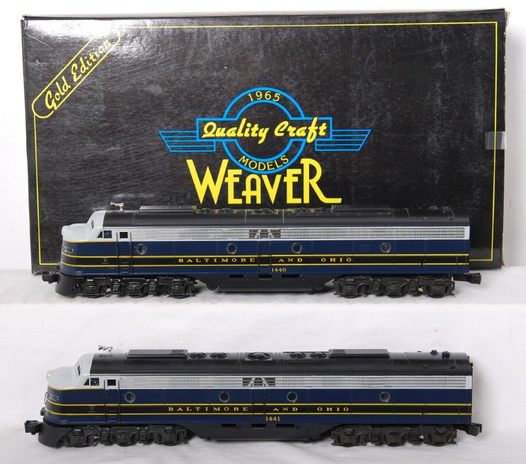 Weaver B&O E-8 A-A diesel locomotives: Weaver modern O gauge Baltimore and Ohio EMD E-8 A-A diesel locomotive pair in OB. Locos features dual motors, constant voltage headlights, and more. Locos are C8 with light run time. OB has some wear