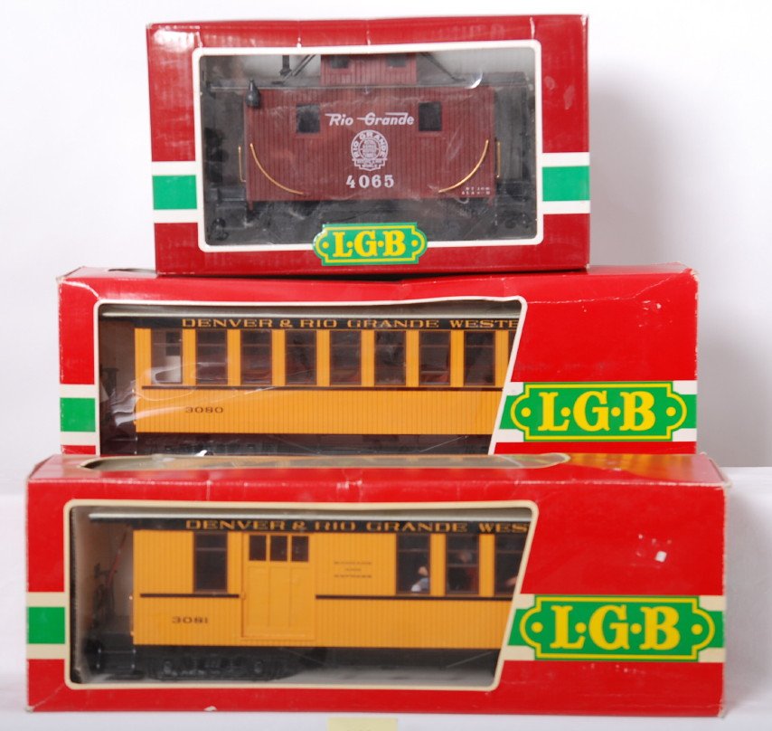 3 LGB Rio Grande cars 3080 3081 4065: LGB modern G scale Rio Grande cars in OBs. Includes 3080 coach, 3081 combo car, and 4065 caboose. Cars are C8 with run time. OBs have some corner wear.