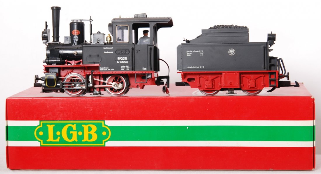 LGB 2015D loco and tender: LGB modern G scale 2015D loco and tender. Loco and tender are C7-8. Loco is dusty and has a loose cab window which is included, also a broken whistle. OB has some light wear.