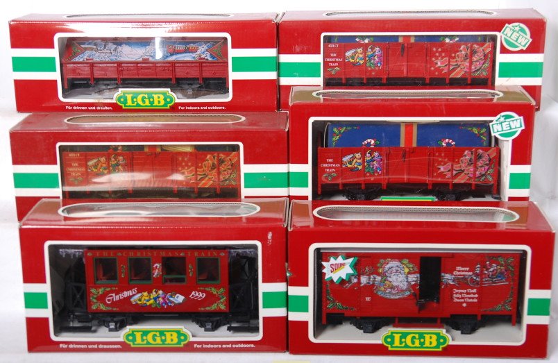 6 LGB Christmas cars 3907 4021CT, 4335S, etc: LGB modern G scale Christmas freight cars in OBs. Includes three 4021 CT gondolas (one in incorrect OB), 36079 1999 Christmas wagon, 4335S musical boxcar, and 45110 covered gondola. Cars are C8 with r