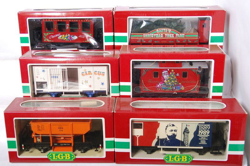 6 LGB freight cars 44650, 36075, 4041, etc: LGB modern G scale freight cars in OBs. Six cars include 4036 Circus cage boxcar, 41120 Christmas tree work caboose, 36075 2000 Christmas coach, 46650 Christmas caboose, 4028FR France boxcar, and 4041