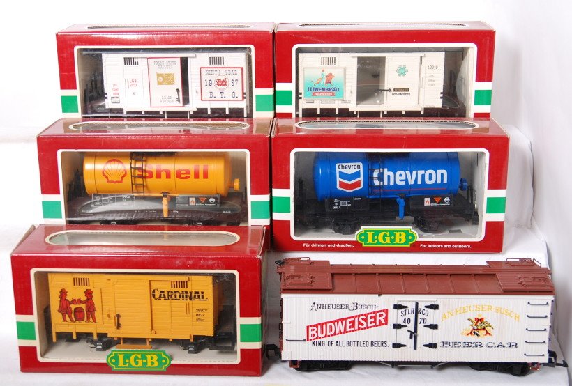 6 LGB freight cars 42310, 44400, 4040S, etc.: LGB modern G scale freight cars in OBs. Six cars include 42310 Lowenbru reefer, 44400 Chevron tank, 4040S Shell tank, 4034 Cardinal reefer, 4070 Budweiser refrigerator car, and 4032B Jelena 1987 club 