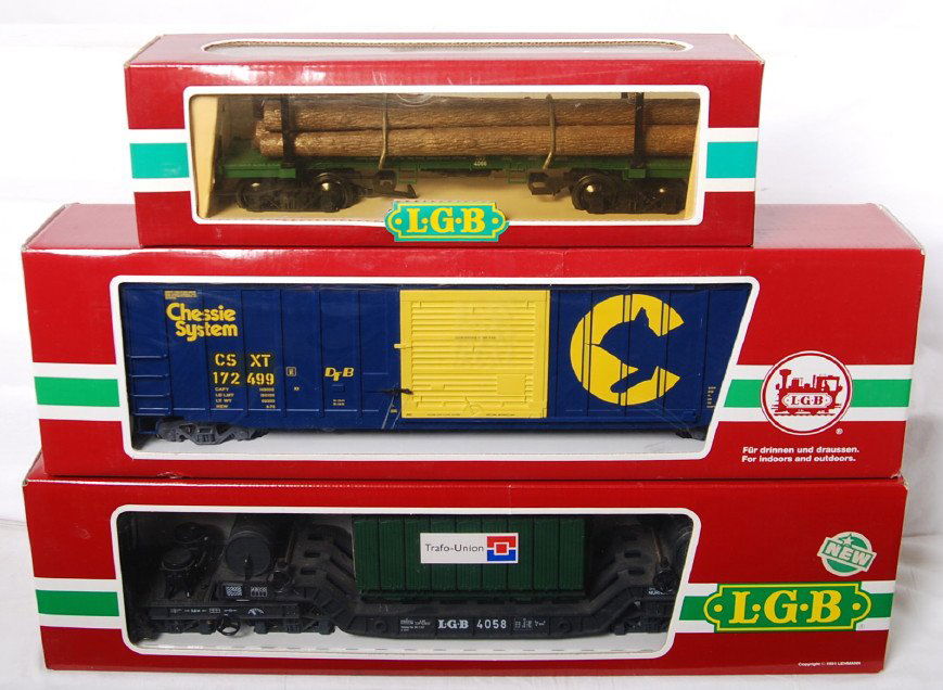 6 LGB freight cars 4069, 4059, 4066, etc.: LGB modern G scale freight cars in OBs. Six cars include 4058 Trafo Union depressed center transformer car, 409035 Chessie boxcar, 4069 flat with LGB trailers, 4066 log car, Morton Salt 1023 limited e