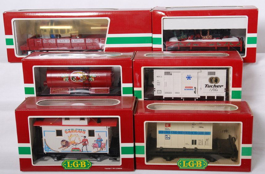 6 LGB freight cars 43614, 42100, 4165, 47400, et: LGB modern G scale freight cars in OBs. Six cars include 43614 flat with train in a bottle, 4003 flat with Vereins container, 42100 holiday flat with locos, 47400 Christmas tank car, 4165 Circus caboo