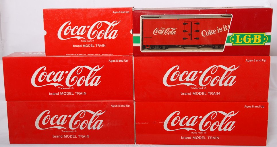 6 LGB Coca Cola freight cars: LGB modern G scale freight cars in OBs. Six Coca Cola cars include 4391, 42912, 45352 with sound, 4072, 42911, and 4291. Cars are C8 to C9. OBs have some dirt.
