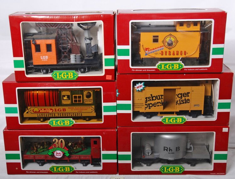 6 LGB freight cars 42260, 4025, 4049, etc.: LGB modern G scale freight cars in OBs. Six cars include 42260 Augsburger wagon, 4025 RHB flat with tank, 4049 work caboose with light, 47656 Durango caboose, 41124 30th anniversary flat, and 30421 ke