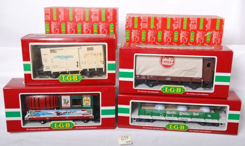 6 LGB freight cars 4065, 4032L, 43610, etc: LGB modern G scale freight cars in OBs. Six cars include 31420 keg car, 4032L Lowenbrau boxcar in C7 condition with staining, 4065 caboose, 40130 LGB covered car, 43610 Worlds Greatest Dad flat, and 4