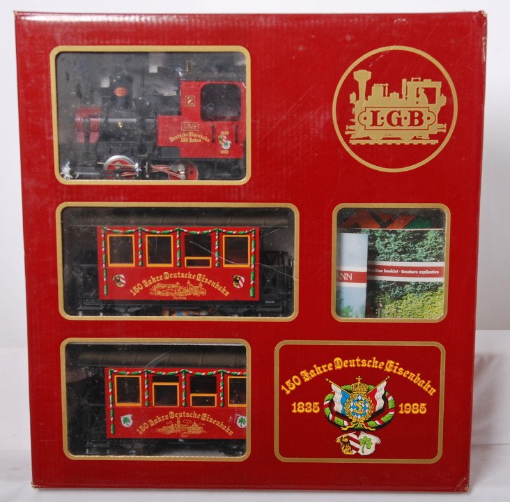 LGB 1985 Christmas set: LGB modern G scale 1835-1985 Christmas set in OB. Includes #2 loco, Nurnberg coach, and Furth. Trains are C8 with run time. Transformer is included, but track is missing. Set box has some light wear.