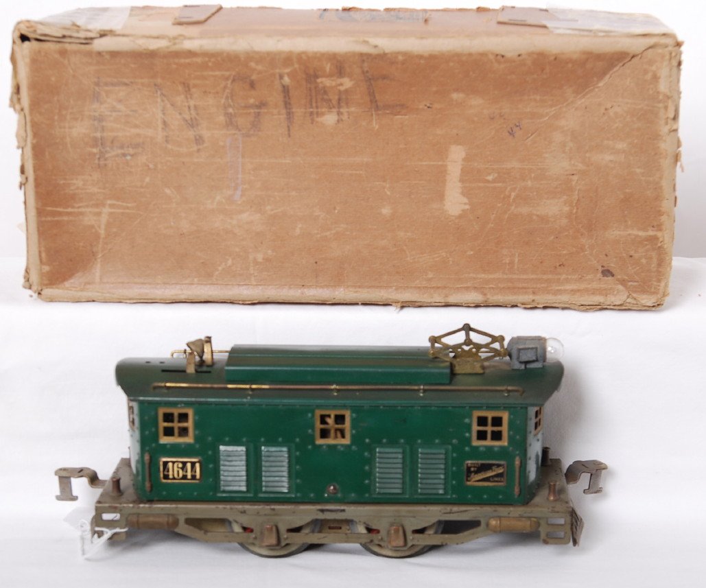 American Flyer 4644 electric wide gauge loco in OB: Prewar American Flyer wide gauge 4644 electric locomotive in an original box. Loco should clean and polish to look C6. Loco has reproduction wheels and headlight has casting fatigue. Box is tape repai