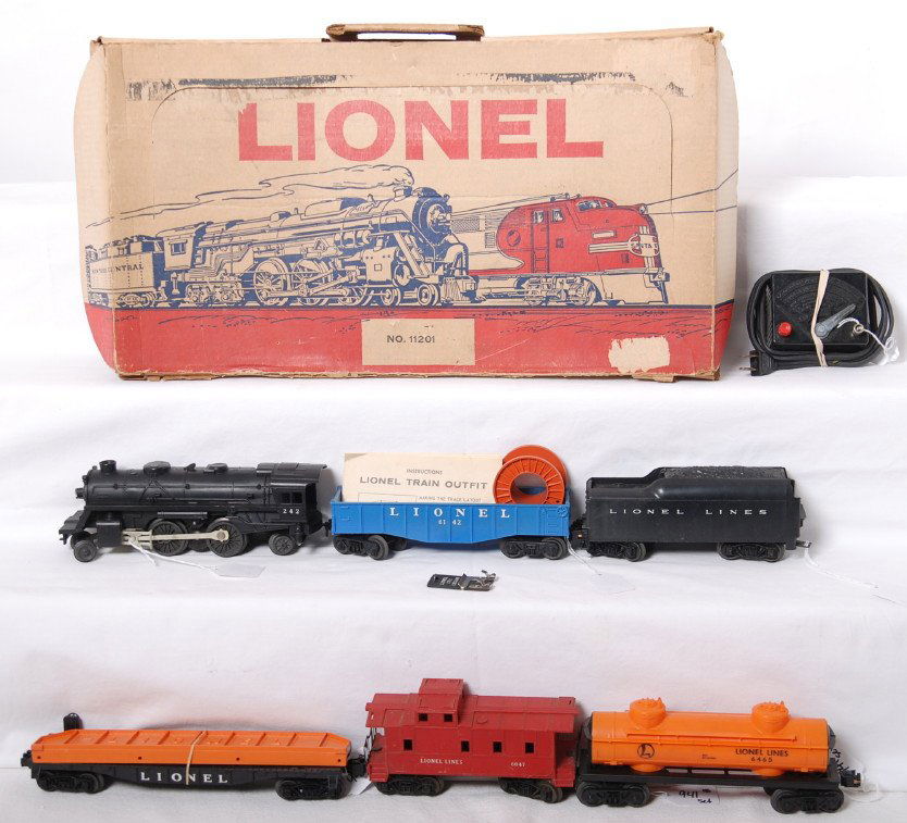 Lionel 11201 steam freight with headlight set: Postwar Lionel O gauge 11201 steam freight with headlight set in original box consisting of 242 steam loco, unnumbered tender, unnumbered flatcar with bridge girder, 6465 tank, 6142 gondola w/cable re