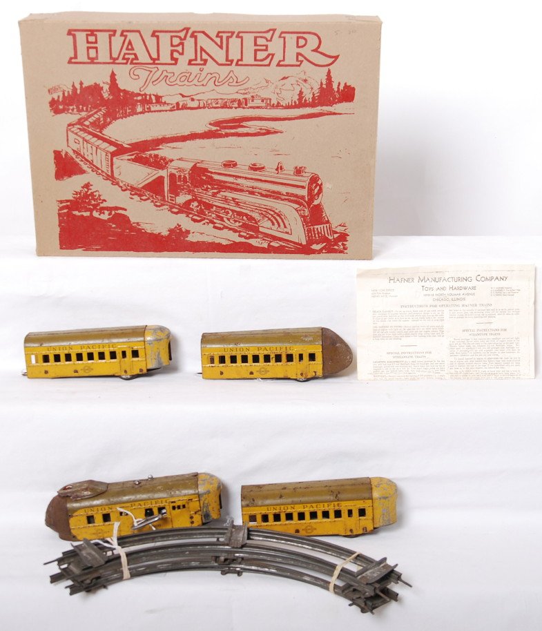 Hafner Union Pacific M-10000 streamline diesel art: Prewar Hafner O gauge Union Pacific M-10000 streamline articulated diesel passenger train, mechanical powered unit, two coaches, and observation car. Powered unit has rust around the headlight and on