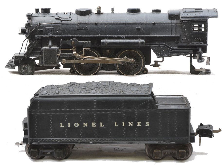 Lionel 229 Black Steam Loco 1666TS Tender: Lionel prewar O gauge 229 black 2-4-2 steam loco and a 1666TS tender that were part of an unusual Sears freight set no. 8125, circa 1942. The rear truck on the loco is broken but included and the valv