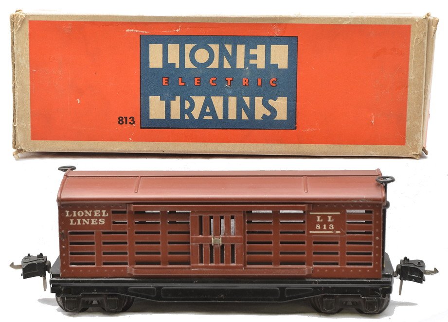 Lionel 813 Rubber-Stamped Tuscan Cattle Car OB: Scarce Lionel prewar O gauge 813 rubber-stamped Tuscan painted cattle car, circa 1941 with black ladders, brake wheels and journals in OB, C7-8. The OB has tape repaired flaps and shows some wear.