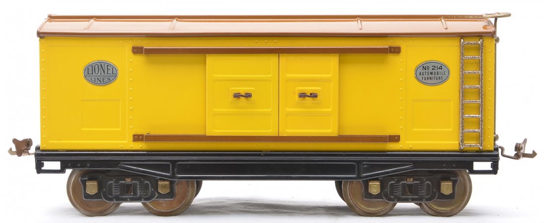 Lionel Std. Ga. 214 Yellow Boxcar w/Brown Roof: Lionel prewar standard gauge 214 yellow boxcar with brown door guides and roof, nickel trim, plates and journals. The paint on this boxcar is outstanding, very bright and clean, however the wheels, co