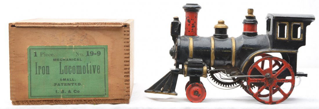 I. B. & Co. no. 19--9 Clockwork Cast Iron Loco: I.B. & Co. no. 19-9 clockwork cast iron locomotive in a wooden box with a sliding lid. Loco is C6. The label on the box is fully intact.