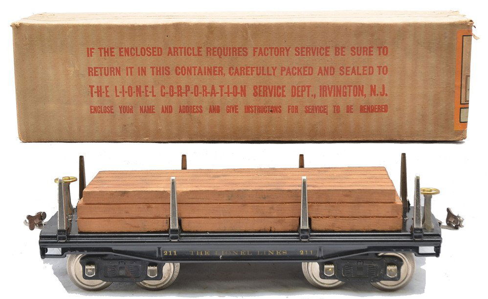 Lionel 211 Black Flatcar w/Wood Load OB: Lionel prewar standard gauge 211 black flatcar with lumber load, brass brake wheels, nickel stakes and journals in OB, C7. The box has all flaps attached and the label is intact.