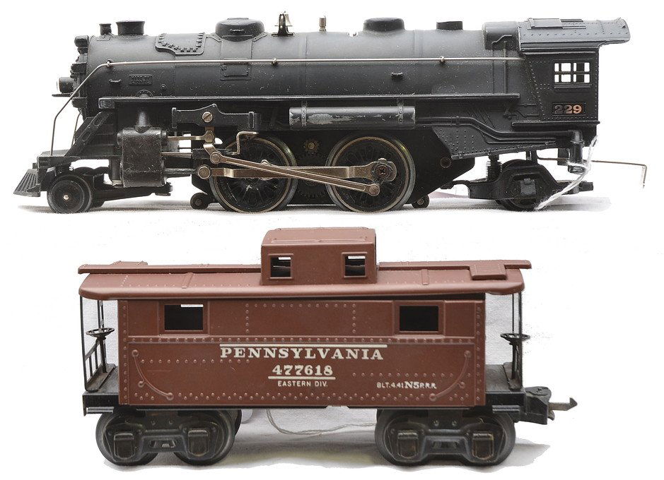 Lionel Prewar 229 Black Steam Loco 2672 Caboose: Lionel prewar O gauge 229 black 2-4-2 steam loco. The loco has rubs on the side, C7-8. Also included is a 2672 brown Pennsylvania caboose, C8.