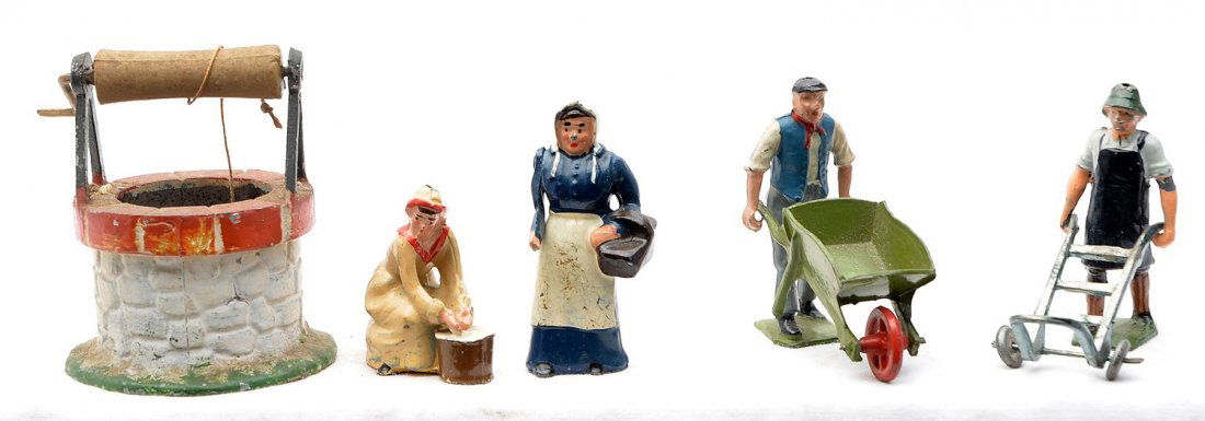 Britains Lead Figures Depose Wishing Well: Britains lead figures and accessories including; milk maid washing clothes, man pushing wheelbarrow, man pushing a dolly and farmers wife with basket. Also included is a Depose lead wishing well made