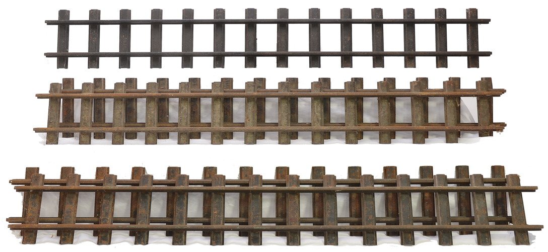 Buddy L five Sections of no. 1200 Straight Track: Buddy L five sections of no. 1200 straight track each four foot in length. The track sections are covered with surface rust.