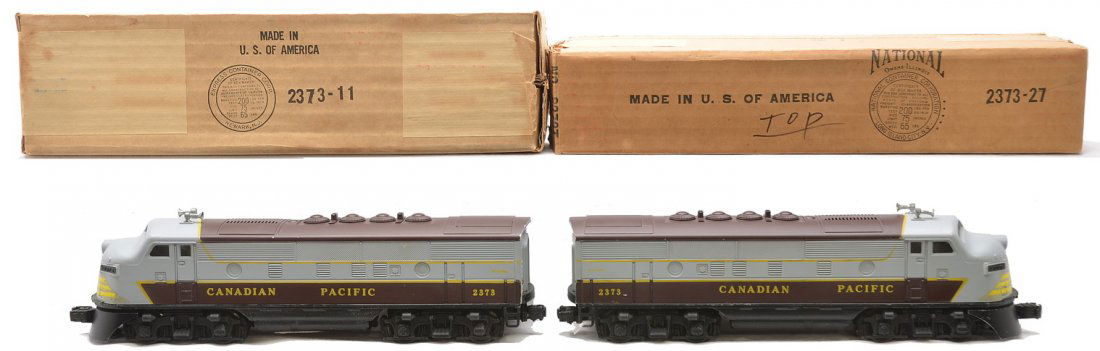 Lionel 2373P/T Canadian Pacific F3 AA Diesels OBs: Lionel postwar 2373P/T Canadian Pacific F3 AA diesel units in OBs. Both decals are intact with minor flaking. The power A unit has surface corrosion on the battery cover. The power A chassis is C7 and