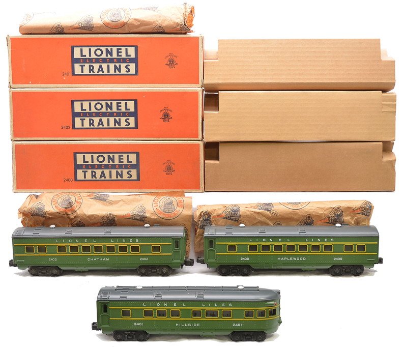 Lionel Green/Gray Pass Cars 2400 2402 2401 OBs: Lionel postwar green and gray passenger cars including; 2400 Maplewood Pullman, 2402 Chatham vista dome and a 2401 Hillside observation all in OBs with original cardboard inserts and paper wrap. Cars 