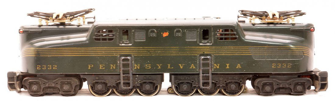Lionel 2332 Green PRR GG1 Diesel w/5 Stripes: Lionel postwar 2332 green Pennsylvania GG1 diesel unit with five stripes. The striping and lettering are intact. One decal herald is missing and the other one is half missing. Diesel is C7-8.