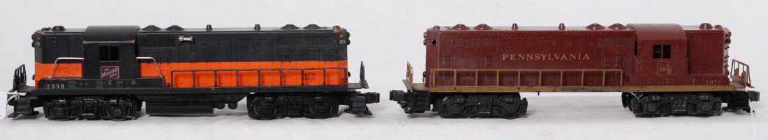 Lionel 2028 and 2338 GP-7 diesel locomotives: Postwar Lionel O gauge 2028 Pennsylvania and 2338 The Milwaukee Road GP-7 diesel road switcher locomotives, hairlines in noses, repainting, etc. Sold as is with no returns. View photos for more descri